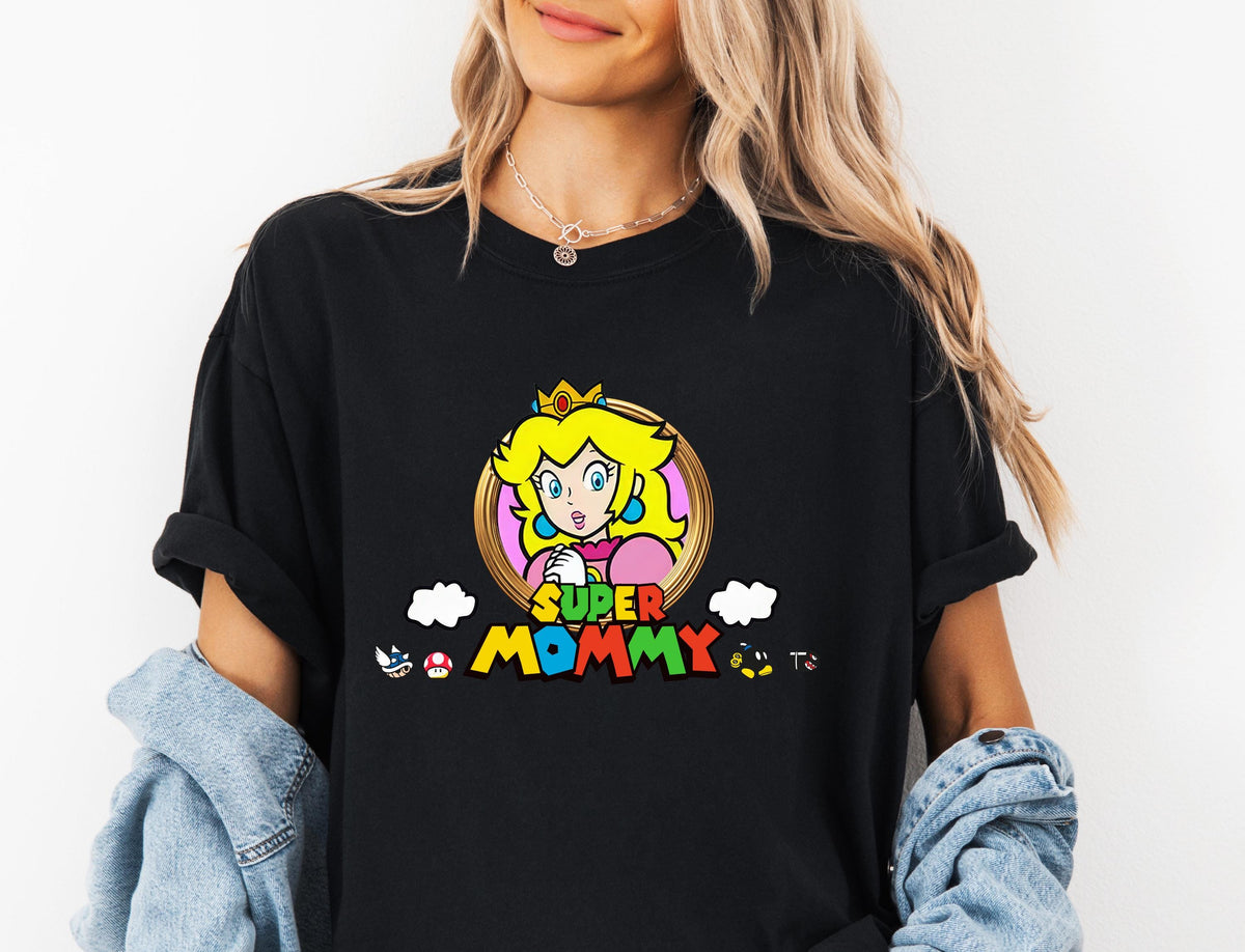 A woman wearing a black t-shirt with a cartoon character and text printed on it.
