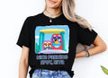 a woman wearing a black t - shirt with an image of two cartoon characters on