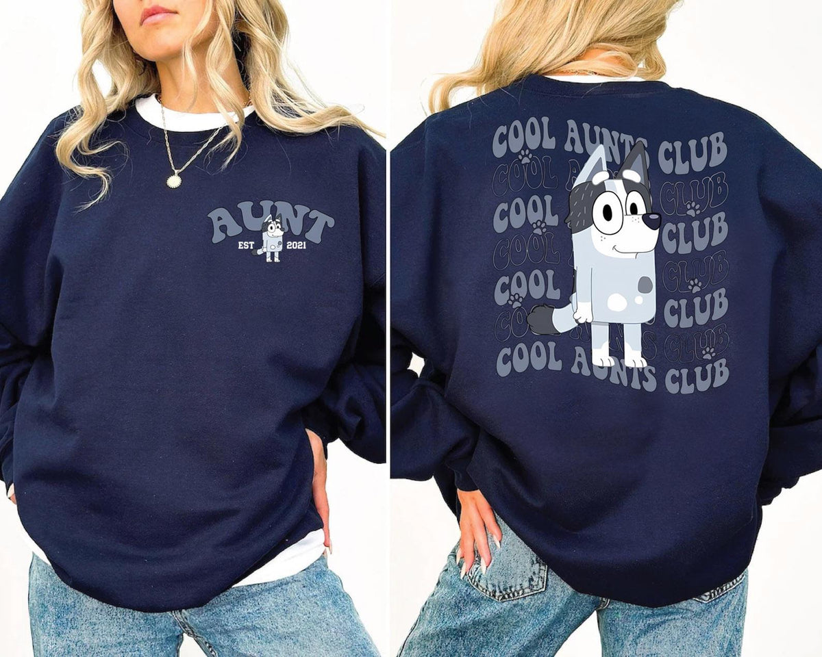 a woman wearing a sweatshirt with a cartoon character on it