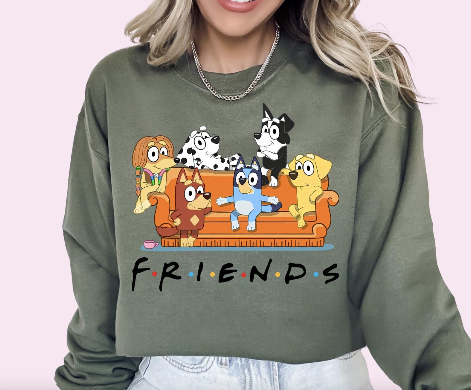 a woman wearing a sweatshirt that says friends on it