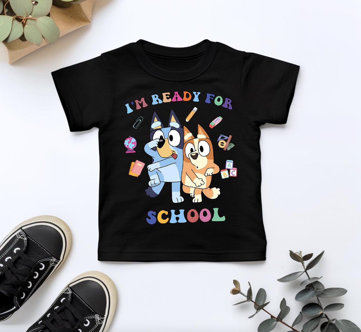 a child's t - shirt with an image of a dog and a cat