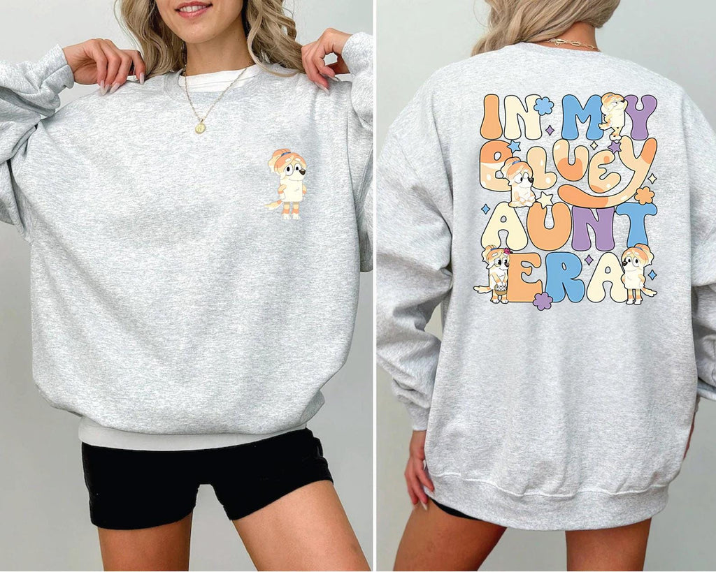 a woman wearing a sweatshirt with a cartoon character on it