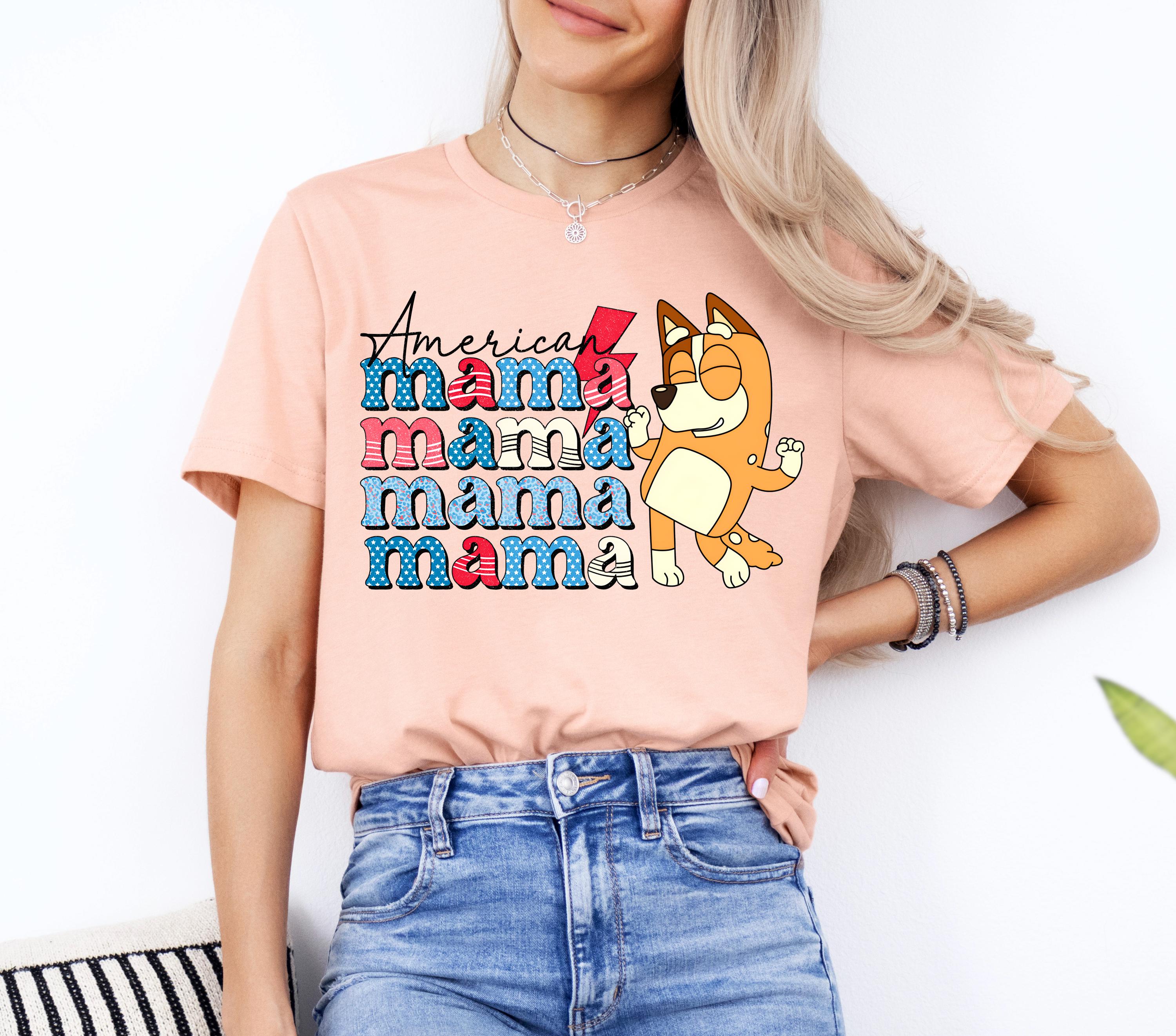 a woman wearing a pink shirt with a dog on it
