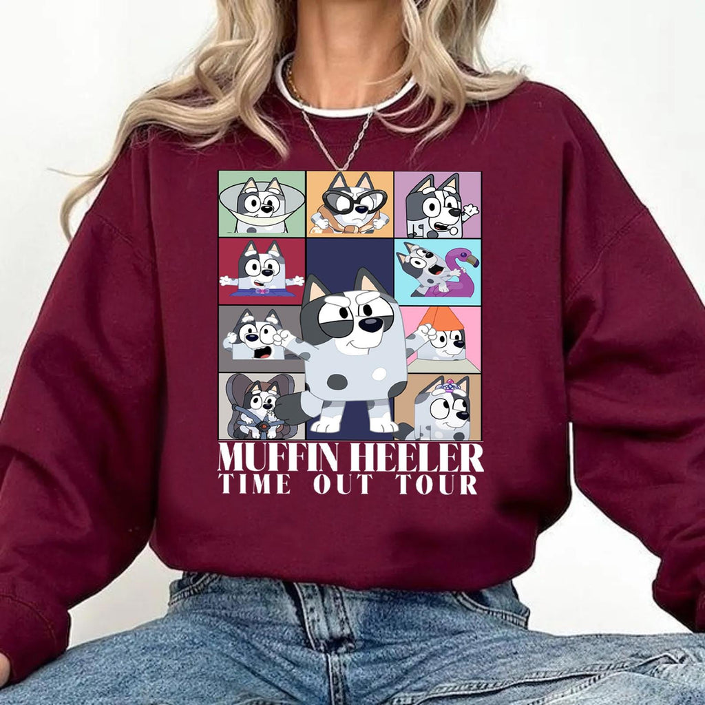 a woman wearing a maroon sweatshirt with cartoon characters on it
