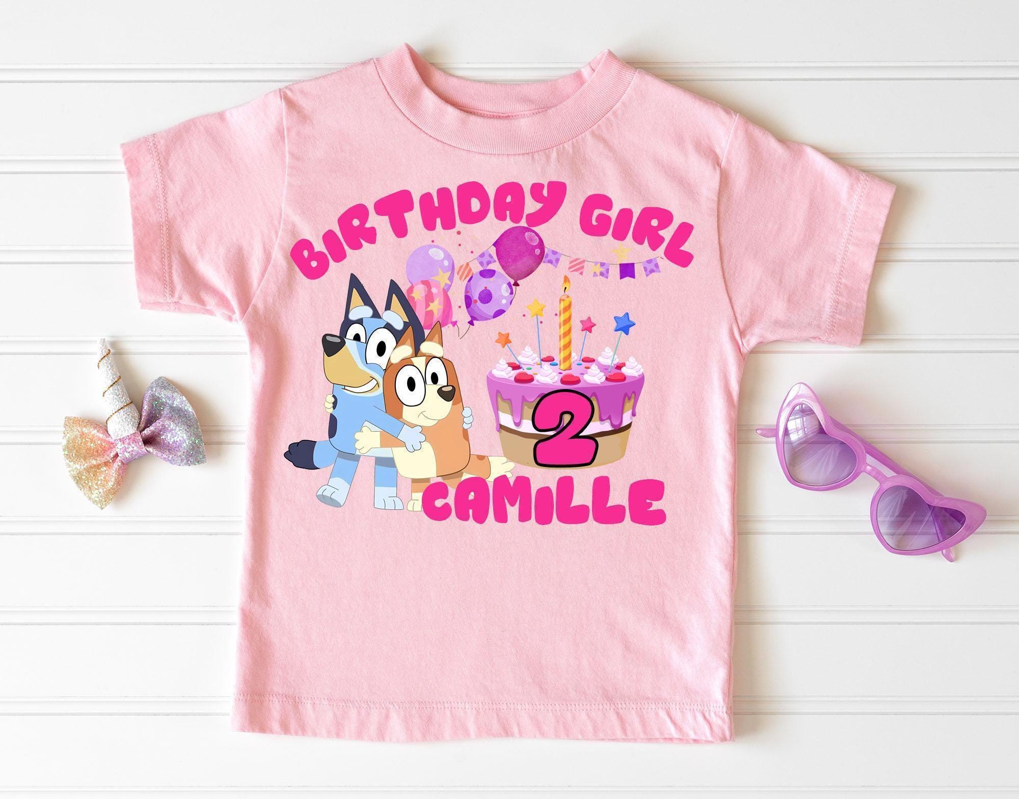 a pink birthday shirt with a cartoon character on it