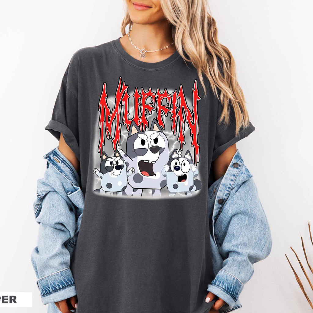 a woman wearing a black shirt with a cartoon character on it