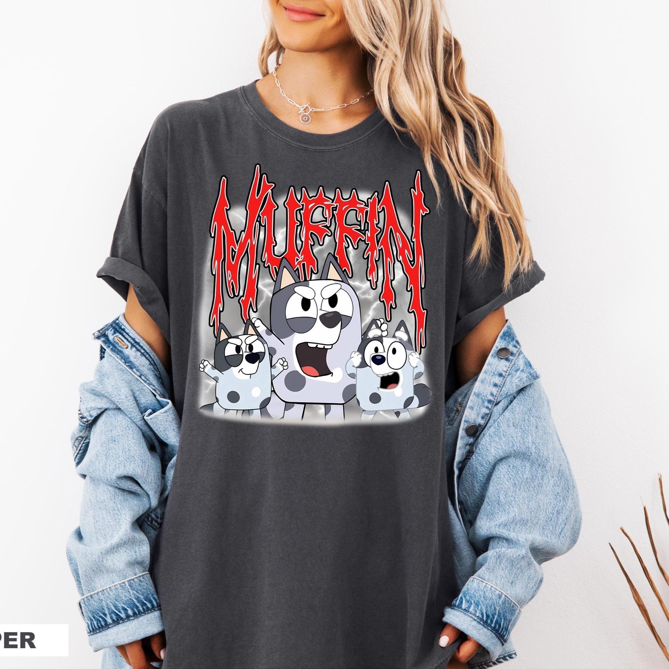a woman wearing a black shirt with a cartoon character on it